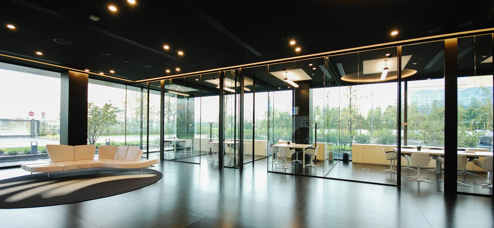 Glass-Walled Lounge Floor-to-ceiling mono glass walls around an open lounge