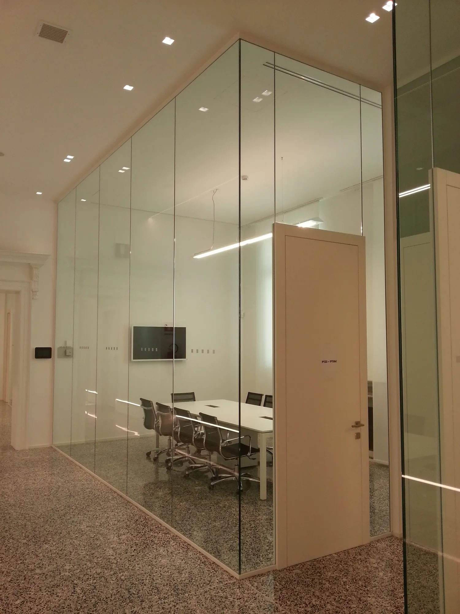 Glass Conference Room Mono glass conference room with wood door and display