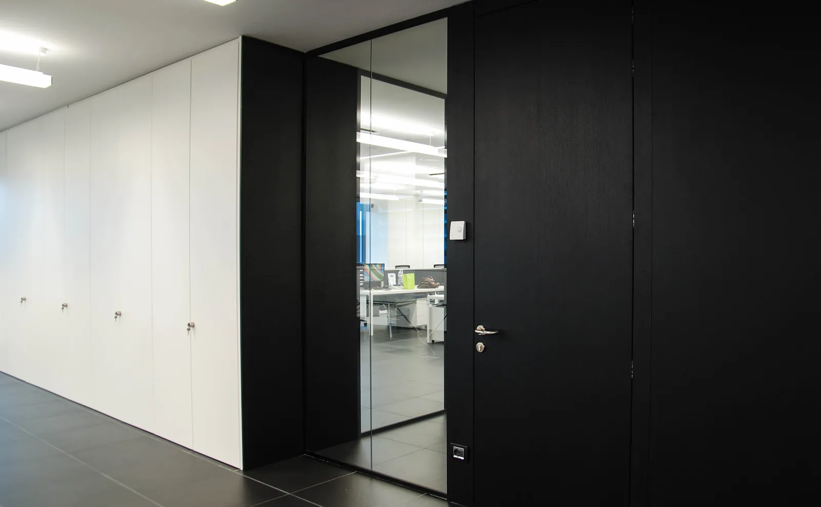 Solid Wall with Door White solid wall partitions with dark wood door