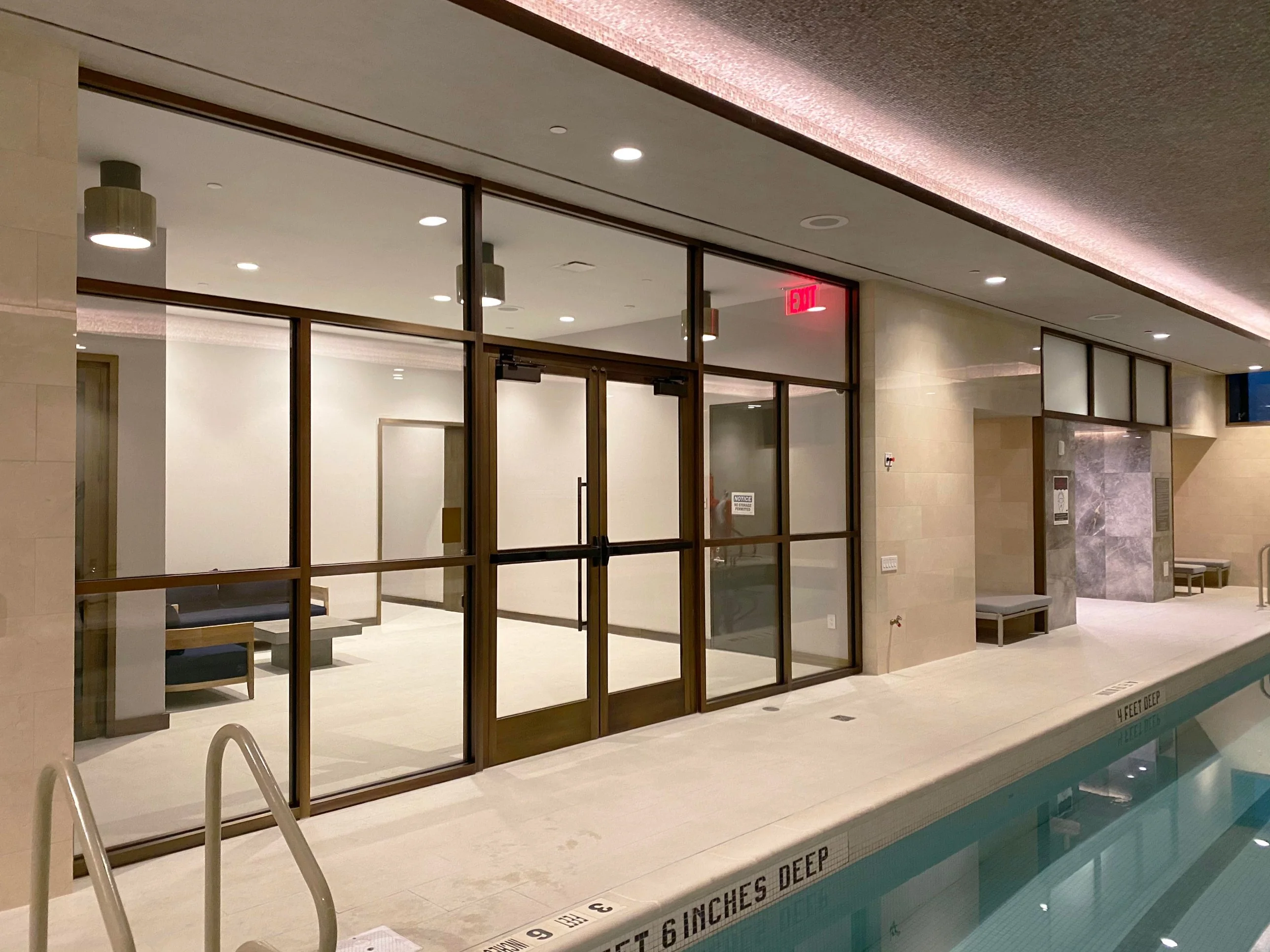 Hotel amenity floor — Metal & Glass · Bronze-framed glass