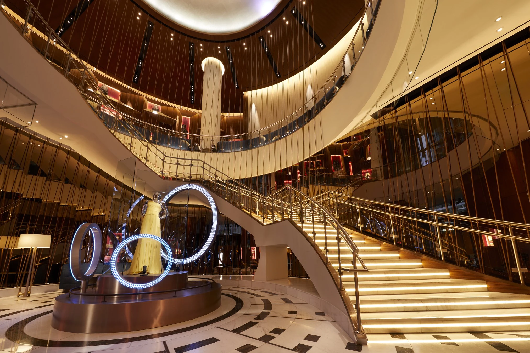 Hotel lobby — Metal & Glass · Grand stair & bronze rod screens