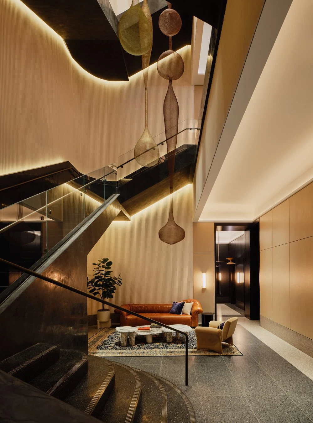 Hotel Lobby — Metal & Glass · Bronze stair & glass guard