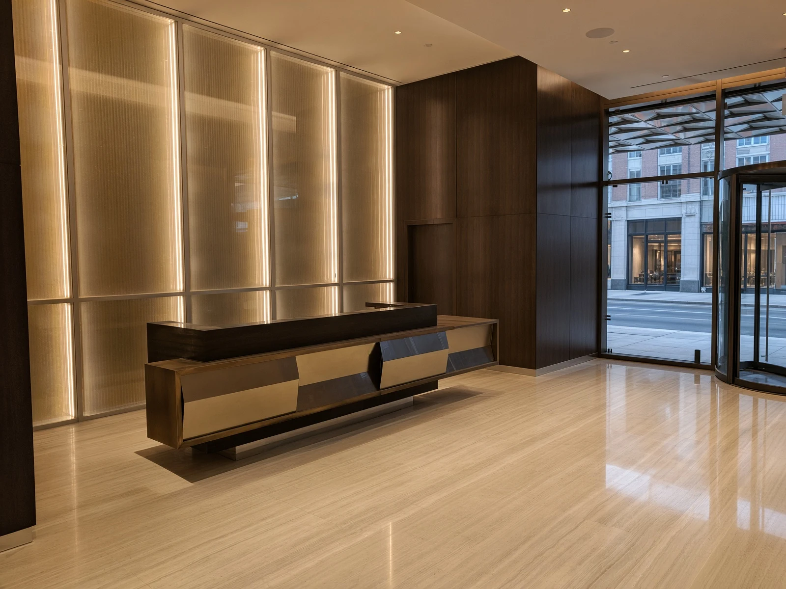 Oskar Lobby — Metal & Glass · Bronze reception desk & backlit glass wall