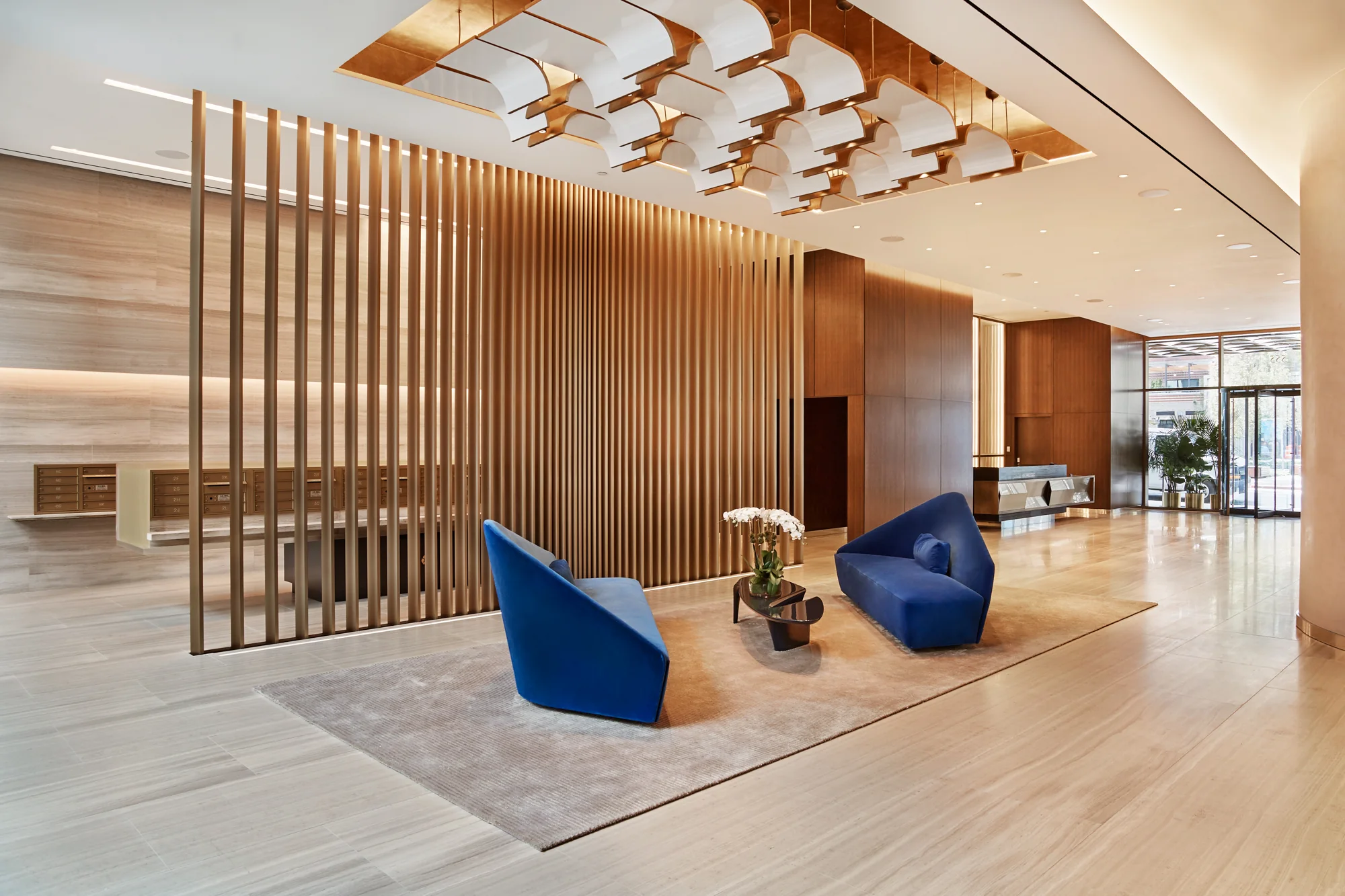 Residential lobby — Metal & Glass · Brass slat screen